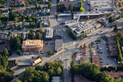 Aerial view of a shopping mall and residential neighbourhood in North Vancouver, BC.
